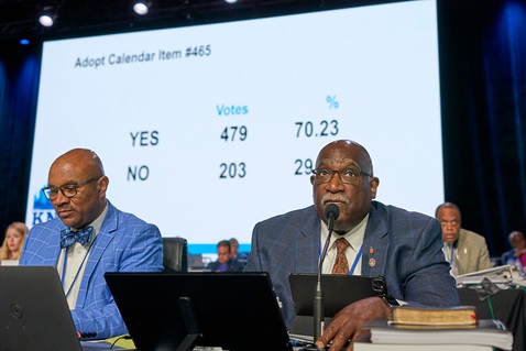 West Ohio Conference Bishop Gregory V. Palmer (right) and parliamentarian Maurice S. Henderson view results from a May 3 vote at the United Methodist General Conference in Charlotte, N.C. The measure removed prohibitions on clergy performing same-sex weddings in their churches. United Methodist News has compiled a list of the legislation passed by this year’s General Conference. Photo by Paul Jeffrey, UM News.