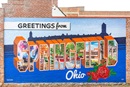 The Greetings from Springfield, Ohio, mural has become a landmark of downtown. United Methodists in Ohio and beyond are stepping up to extend a similar welcome and show support for Haitian immigrants in the city. Springfield experienced more than 30 bomb threats after being targeted by anti-immigrant rhetoric based on false claims. Photo courtesy of Greetings Tour; used with permission.