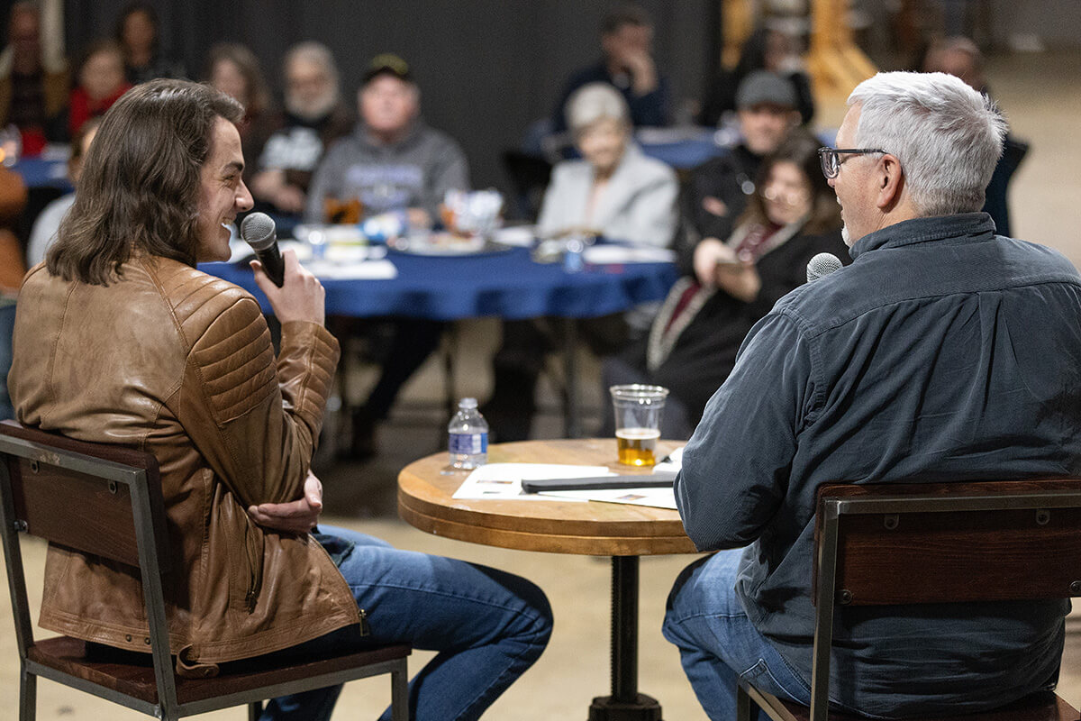The Rev. Dale Cohen (right) leads a discussion about the differences between solitude and loneliness with singer-songwriter Bay Simpson during Crafted Conversations at the Singin’ River Brewing Co. in Florence, Ala. Cohen is senior pastor of First United Methodist Church in Florence.