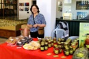 Janet Jabra El Masou, who participates in the YAI sponsored Rural Women's Development Slow Food project, arranges her wares for a market day. Photo courtesy of RWDS.