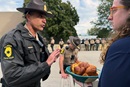 Illinois State Police Lt. Col. Jason Bradley (left) speaks with the Rev. Hannah Kardon, a United Methodist pastor who was among a group of clergy on Oct. 10 asking to bring Holy Communion to detainees in the U.S. Immigration and Customs Enforcement facility in Broadview, near Chicago. The following day another group of clergy also made the same request. Both times Bradley reached out to ICE officials, who denied the clergy entry. Photo by the Rev. Britt Cox, First United Methodist Church in Evanston, Ill.