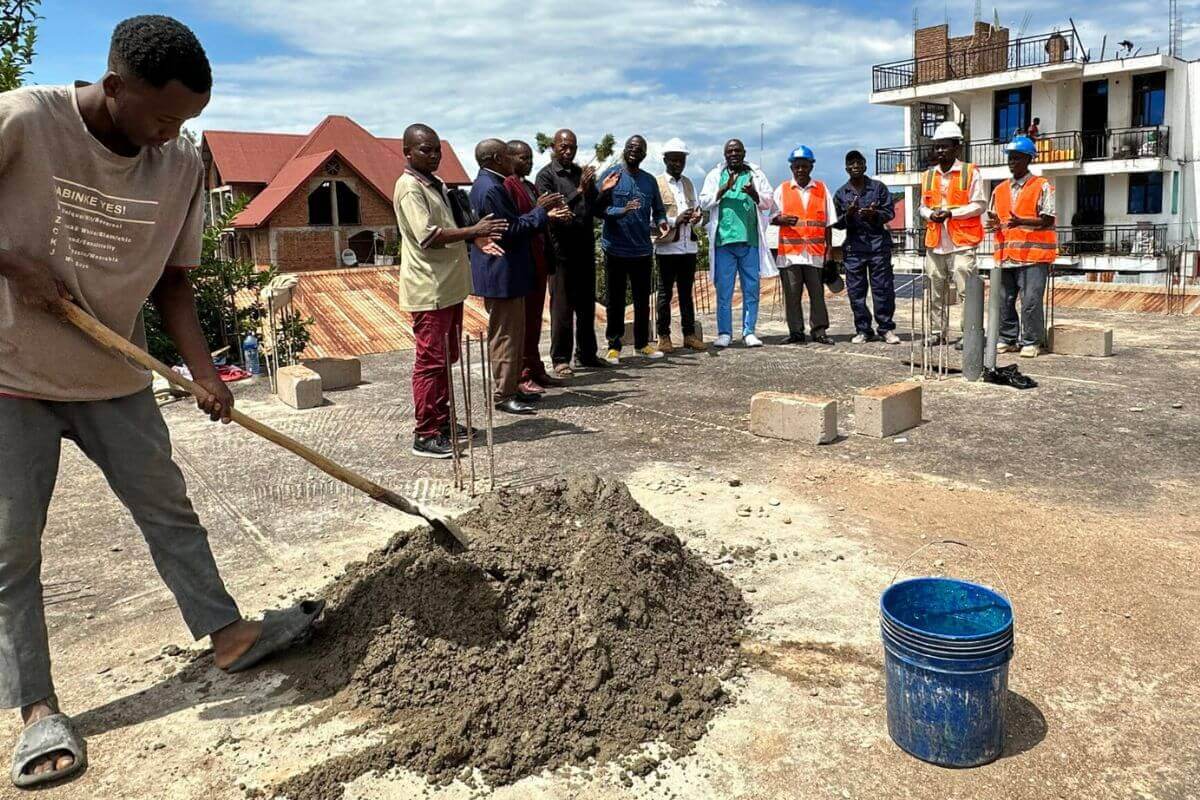 Members of the East Congo Health Board celebrate the groundbreaking for Uvira Clinic's reconstruction. The clinic was ransacked and looted by the M23 group twice but is being rebuilt with funds from Global Ministries. Photo courtesy of East Congo Health Board.