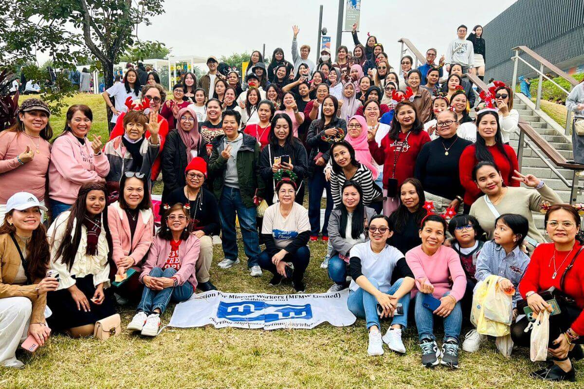Migrants and staff from the Mission for Migrant Workers in Central Hong Kong gather outside for a photo after an advocacy event for migrants rights.  Photo courtesy of MFMW Limited.