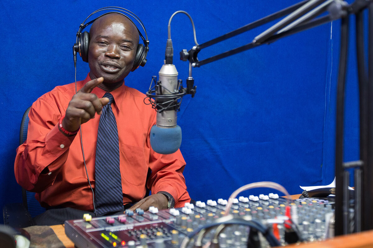 Edward L. Massaquoi broadcasts on ELUM, The United Methodist Church's radio station in Monrovia, Liberia, in 2017. Massaquoi was among more than 40 communicators from across Africa and the Philippines who gathered Nov. 18-20 for the United Methodist Broadcast Network annual meeting in Harare, Zimbabwe, as the network celebrated its 10th anniversary. File photo by Mike DuBose, UM News. 