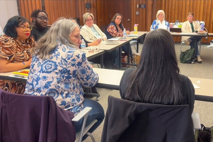 Deacon Dana Neuhauser of New City Church in Minneapolis speaks to the appointive council of the Minnesota Conference and to fellow members of the Wisdom Council, a panel designed to make sure historically underrepresented people have a say in the Minnesota Conference. Image from video by Lilla Marigza, UM News. 