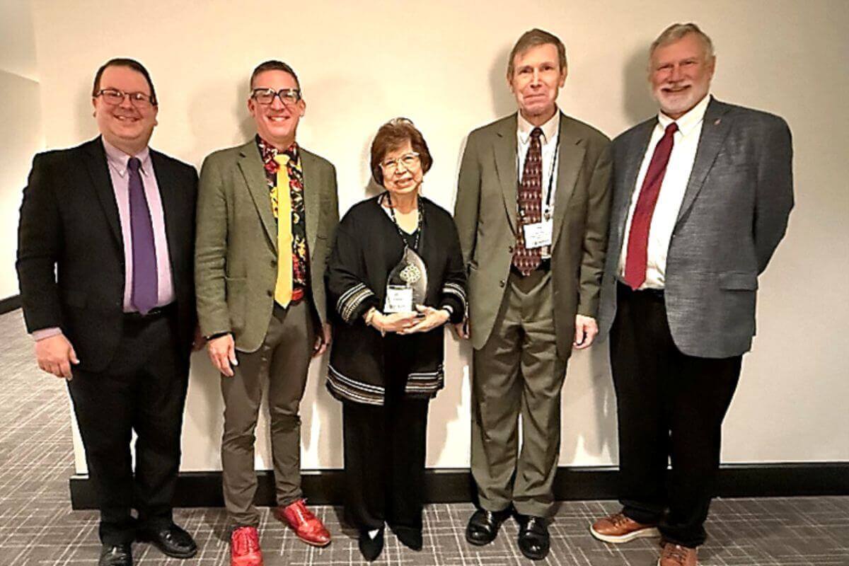(Left to right) Rev. Tom Parkinson, Wespath Nominating and Governance Committee Chairperson; Andy Hendren, Wespath General Secretary; Charles L. Calkins Award recipient Liz Mariano; Dale Jones, Wespath Managing Director, Church Relations; and Bishop Robert Schnase, Wespath Board Chair. Photo courtesy of Wespath.