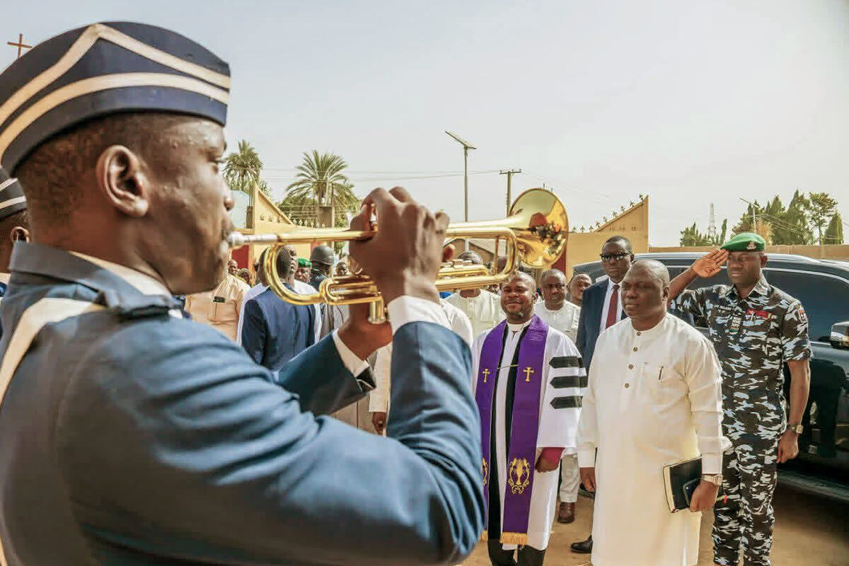 Members of the Boys Brigade brass band of The United Methodist Church in Nigeria welcome Bishop Ande Emmanuel (center with purple stole) and Taraba State Governor Kefas Agbu (right) at a Feb. 22 thanksgiving service at Jatutu Memorial Cathedral in Jalingo, Nigeria. The United Methodist sanctuary was closed by the government at the height of internal conflicts in the denomination in 2016. The United Methodist Church in Nigeria is celebrating a March 30 high court ruling that declares the church’s deregistration by a breakaway group in 2024 “null and void.” Photo courtesy of UMCN Communications.