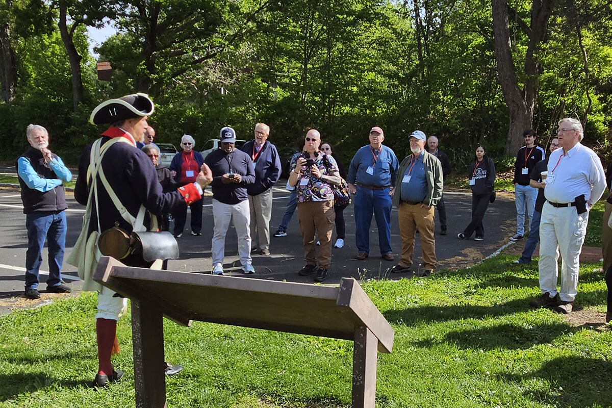 Mark Sirak (left), a resource interpretative specialist and historian, recounts to members of the Northeastern Jurisdiction Commission on Archives and History the 1776 landing of Gen. George Washington’s troops at what is now Washington Crossing State Park in Titusville, N.J. The tour was part of the group’s annual gathering, which coincides with this year’s 250th anniversary of the signing of the Declaration of Independence. Photo by John W. Coleman, UM News.
