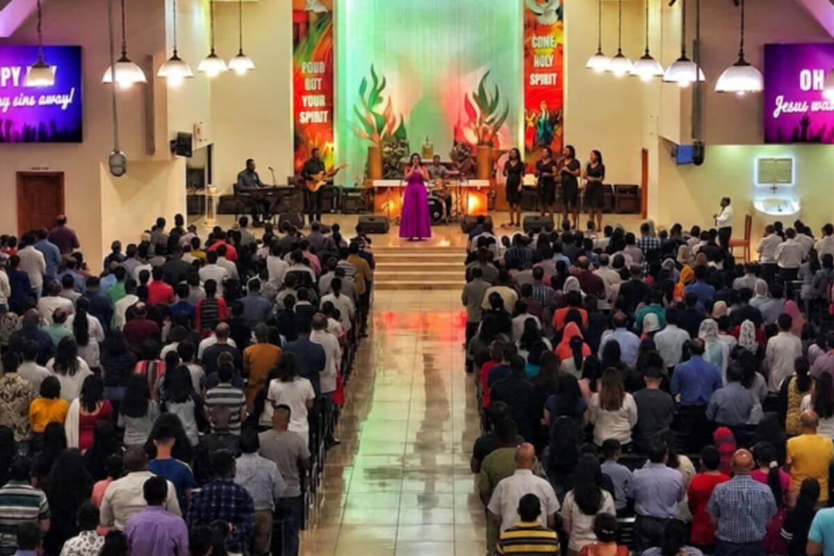 Members gather for a church concert, coming together in worship and celebration through music. (Image created through Envato)