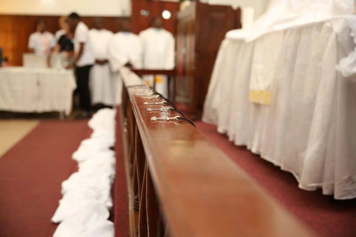 Cross necklaces are lined up on the altar at the 2023 Global Mission Fellows commissioning service in Maputo, Mozambique. Photo: Jacqui Hemphill