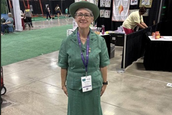 Susan Lawyer, member of the GCUMM Board and longtime Girl Scout Leader serves at the Girl Scout Convention. Picture courtesy of GCUMM.