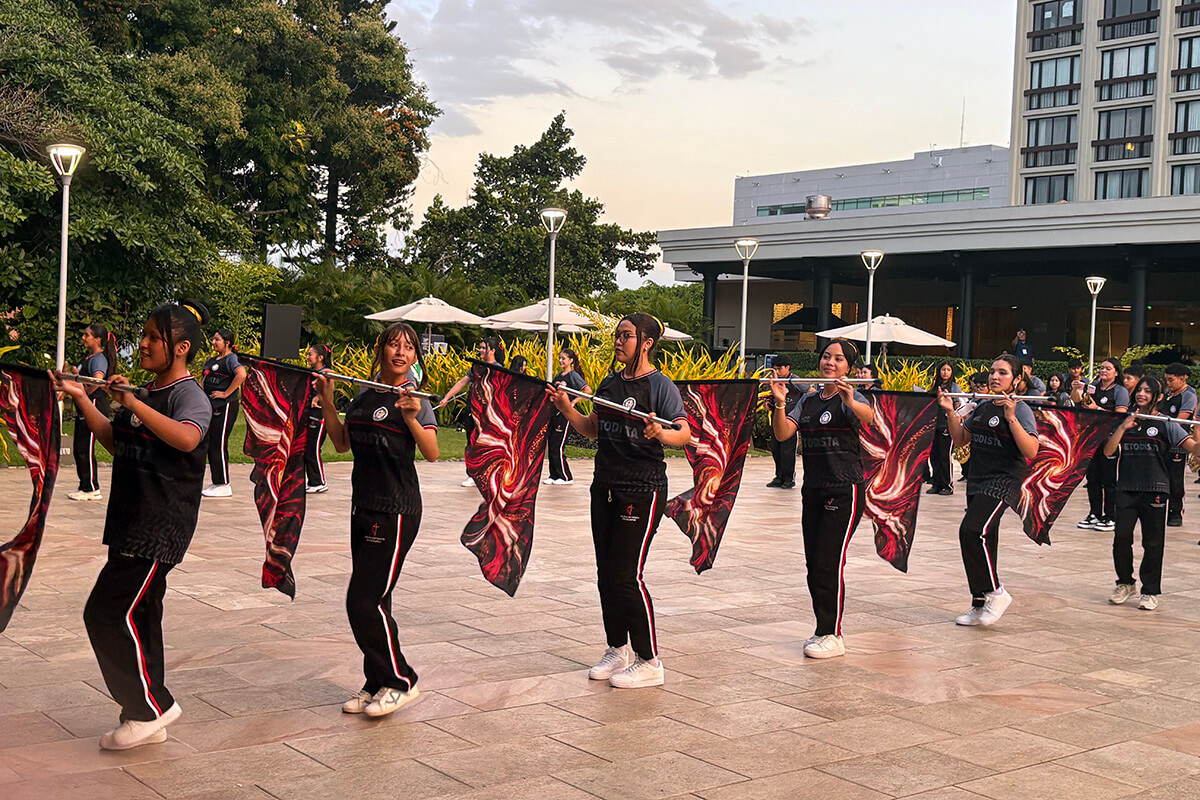 The flag corps and band of the Methodist high school in El Salvador perform on Aug. 14 for members of the World Methodist Council meeting in San Salvador. The Evangelical Methodist Church of El Salvador operates the school and has plans to build an elementary school. Photo by Heather Hahn, UM News.
