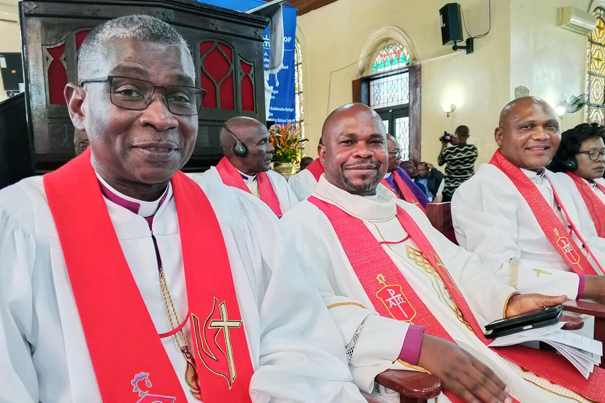Bishops Gaspar J. Domingos, Ande I. Emmanuel and Nelson Kalombo Ngoy follow proceedings during the Africa College of Bishops opening worship service held at First United Methodist Church in Monrovia, Liberia. The church, which was built in 1822, is the oldest Protestant church in Africa. Photo courtesy of Liberia Annual Conference Communications.