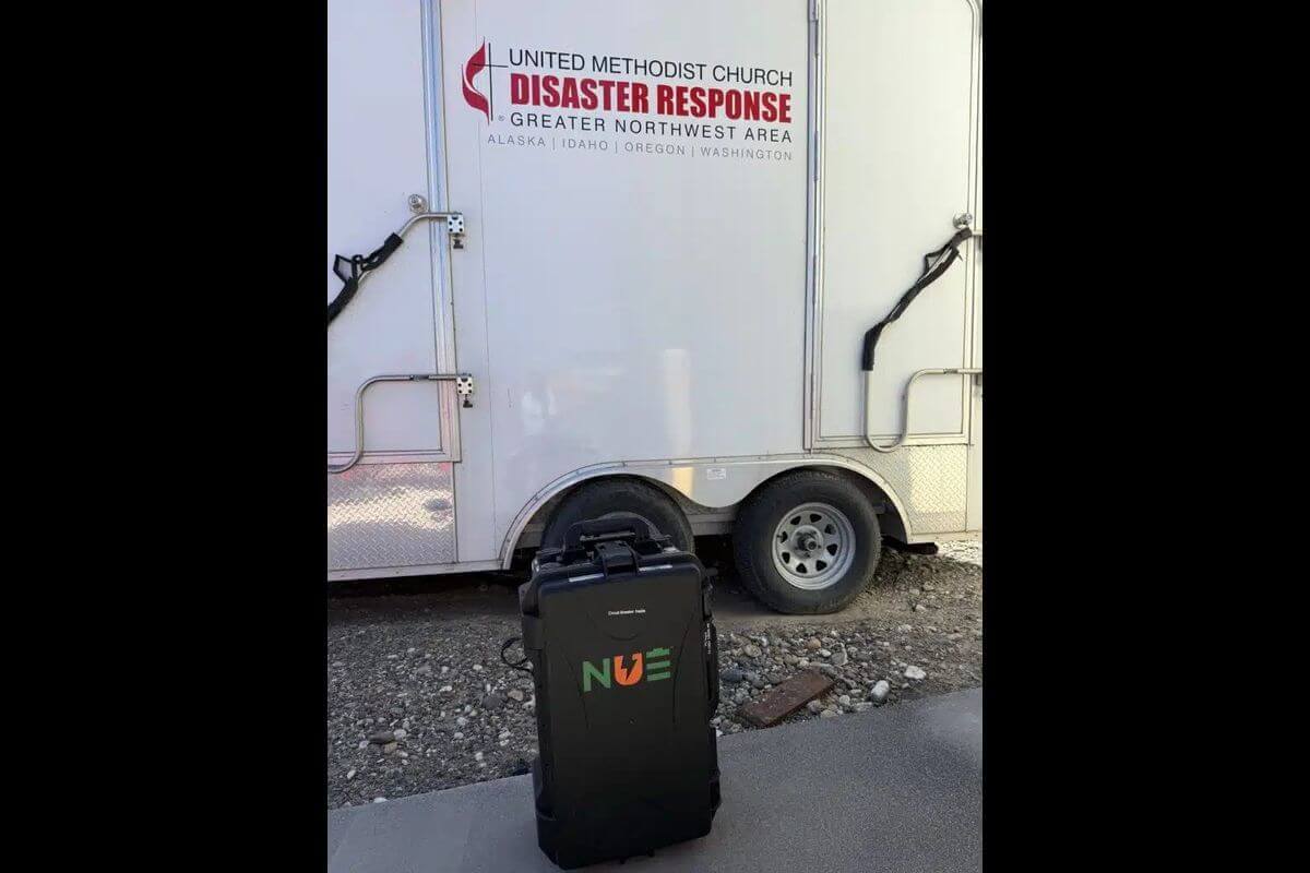 A Suncase 2425 solar suitcase in front of the Greater Northwest Episcopal Area’s shower trailer. Photo: Beverly Touchton