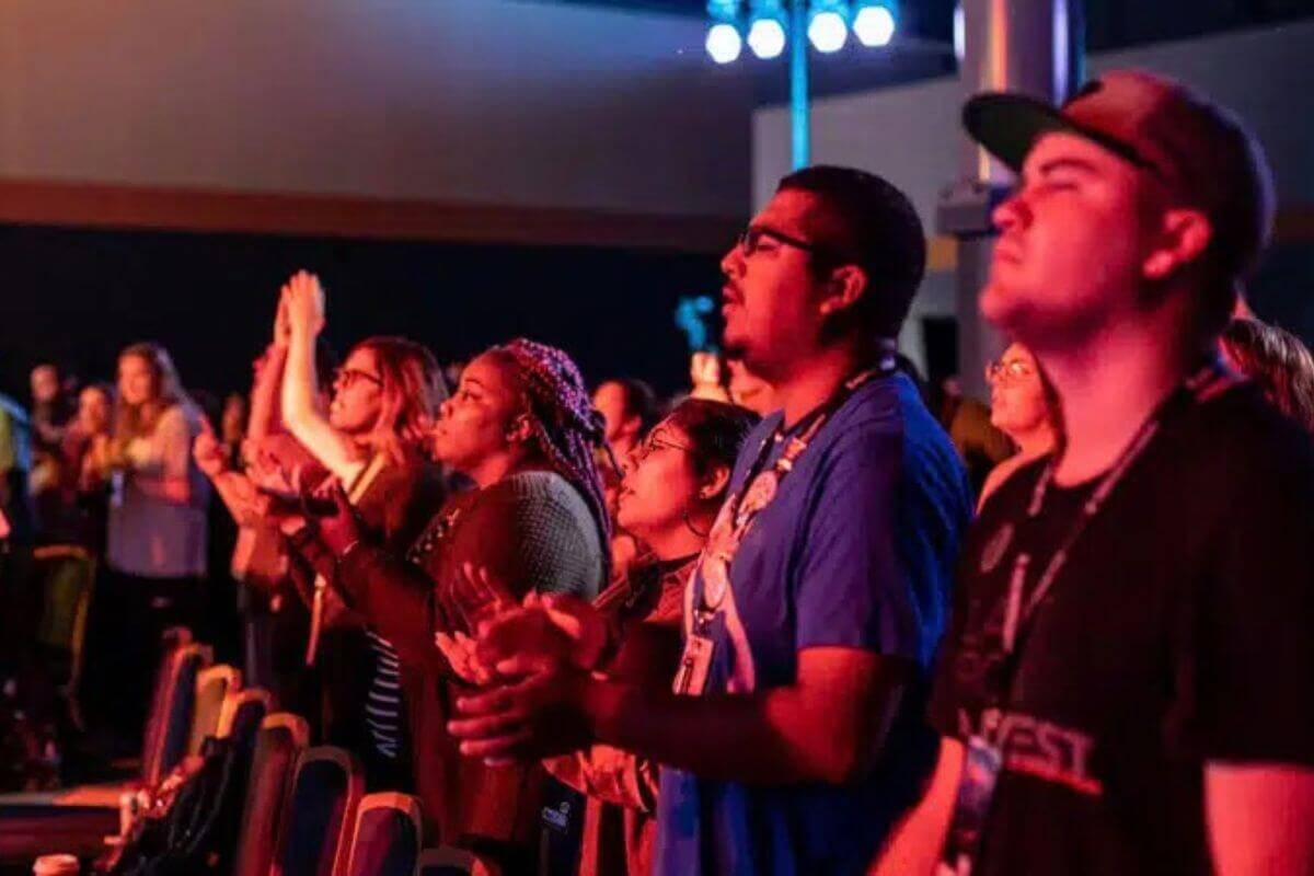 Participants gather for opening night worship at EXPLORATION 2019, joining in music, prayer and reflection as they begin a shared journey of discerning God’s call. Photo by Joseph McBrayer